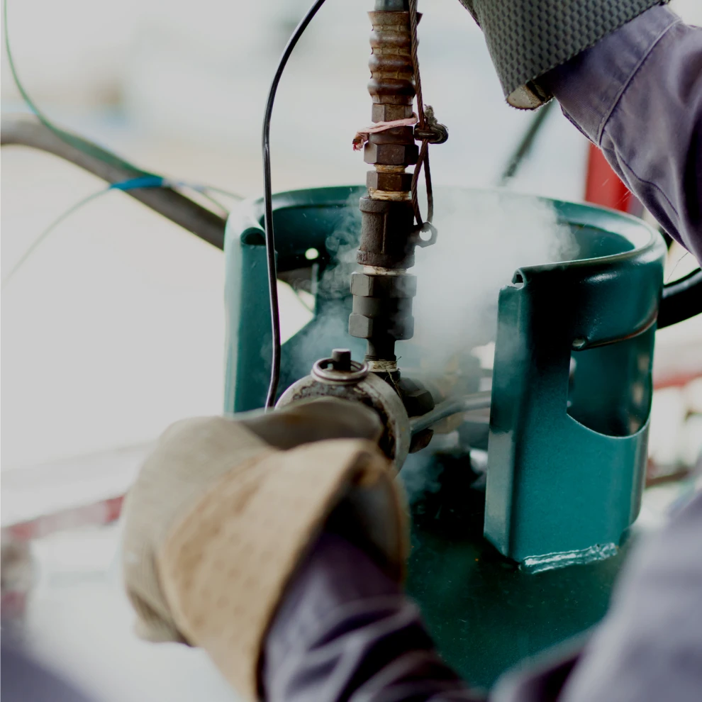 AmSpec employee performs a tank calibration.