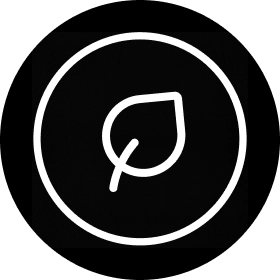 White icon of a leaf inside of a black circle.