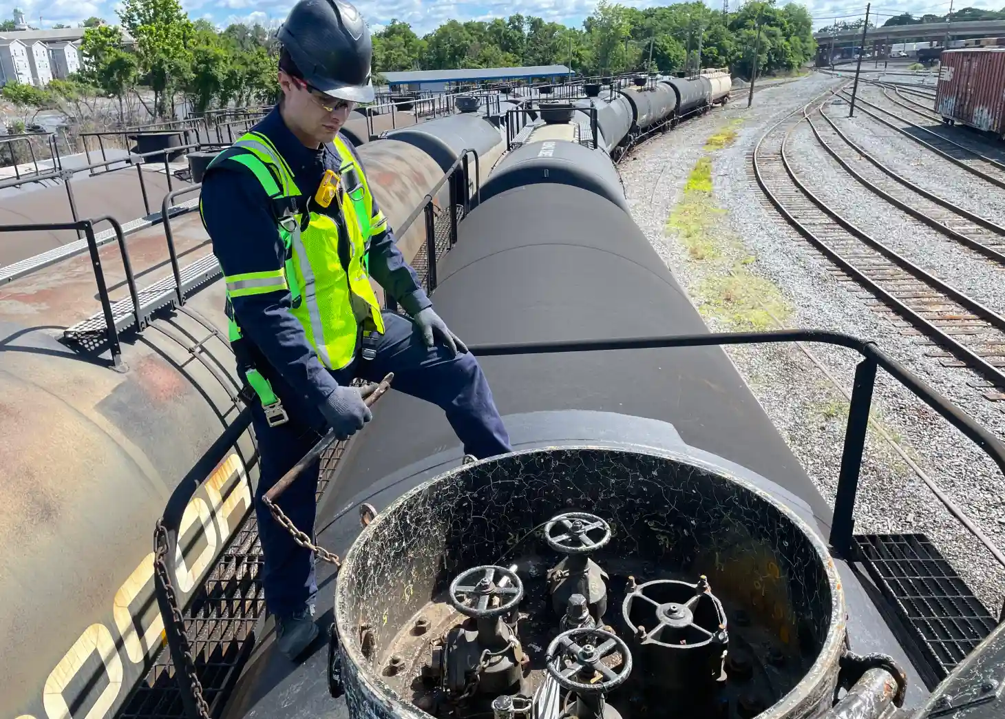 An AmSpec employee inspects a railcar.