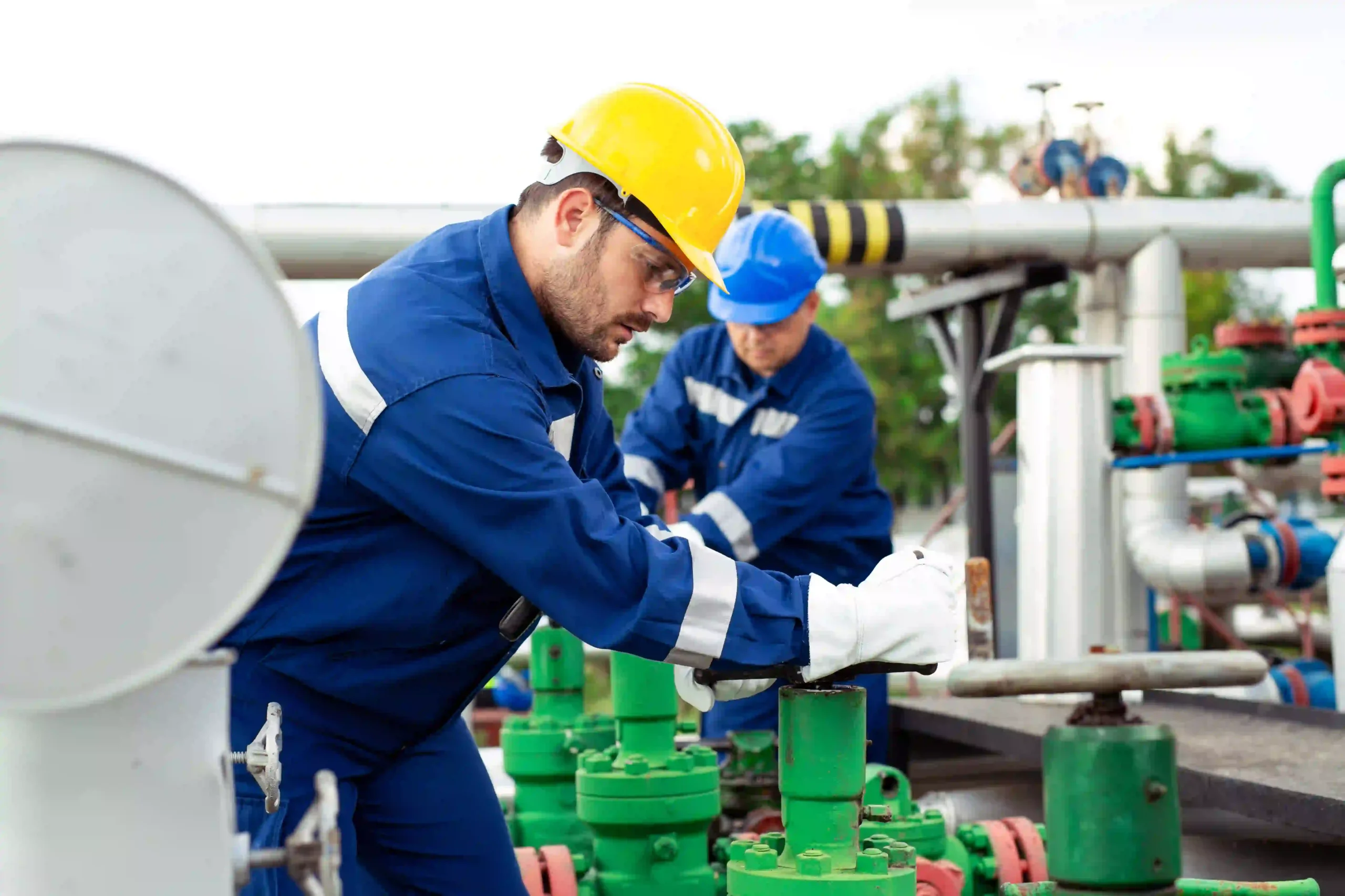 technicians working with petrochemical plant.